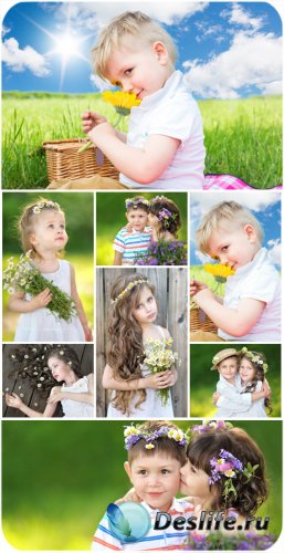    / Small children with flowers, nature - Stock Photo