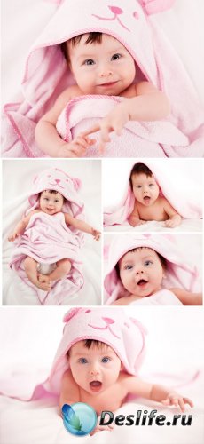      / Charming baby in a pink bedspread - stock photos