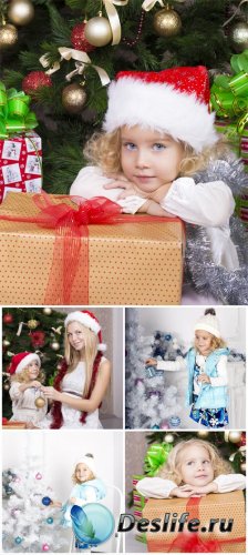  ,    / New Year's Eve, girl at the christmas tree - Stock Photo